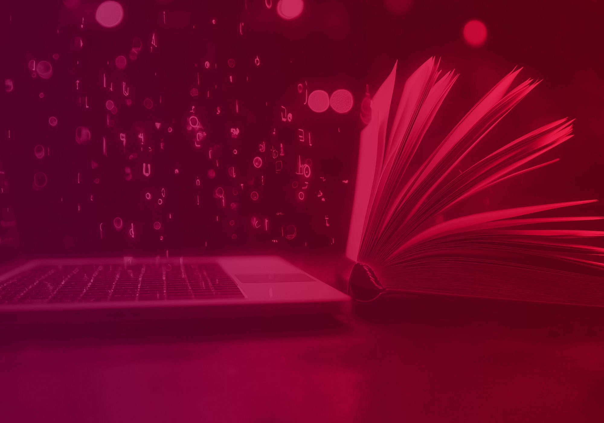 A stylized red-lit scene showing an open book with fanned pages beside a laptop on a desk, with floating digital symbols in the background.