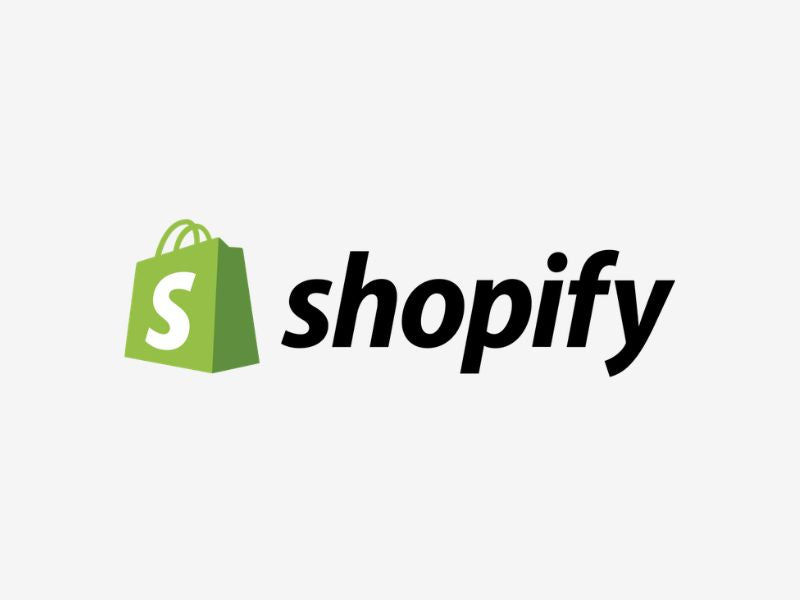 Shopify logo with green shopping bag icon on a white background