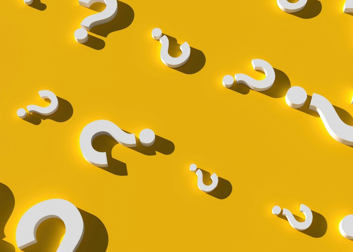 White question marks on a yellow background