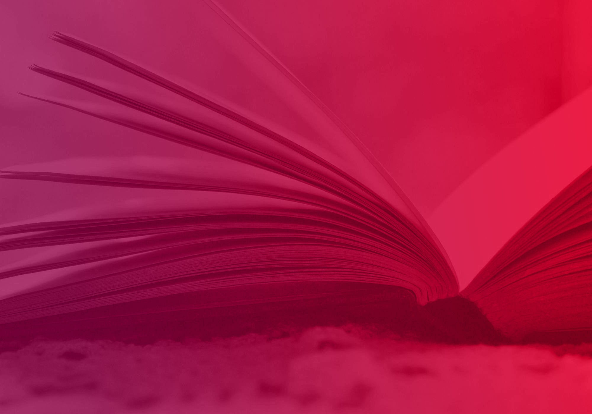 An open book with fanned pages, shown in a close-up shot under a strong pink and red color cast.