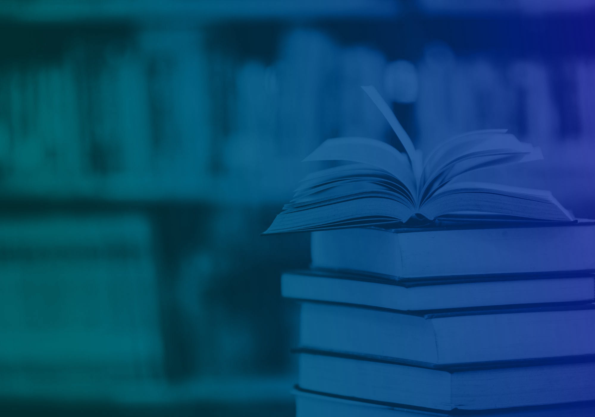 A stack of closed books with an open book resting on top, photographed in a blue-toned library or bookstore setting with blurred bookshelves in the background.