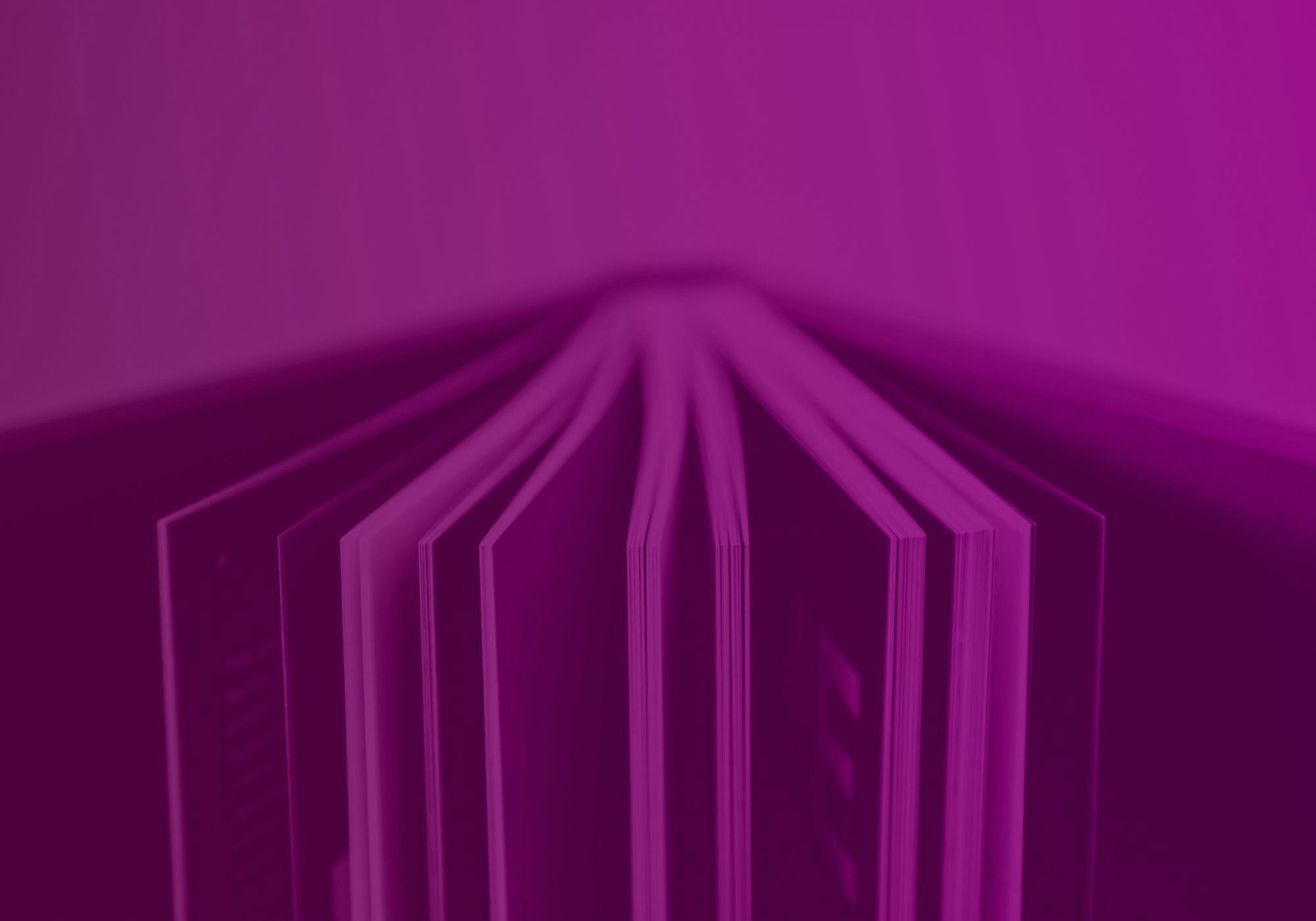 A close-up, low-angle shot of a stack of books or notebooks viewed through a strong magenta-purple tint, with the pages fanned out symmetrically.