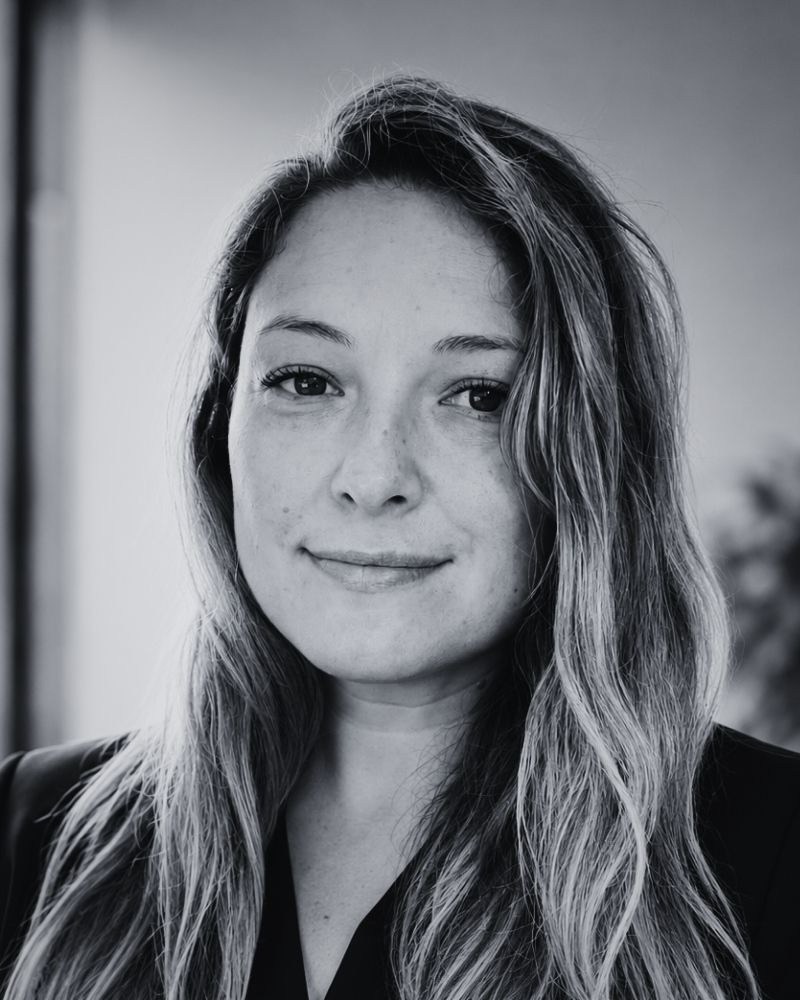 Black and white portrait of a woman with long hair.